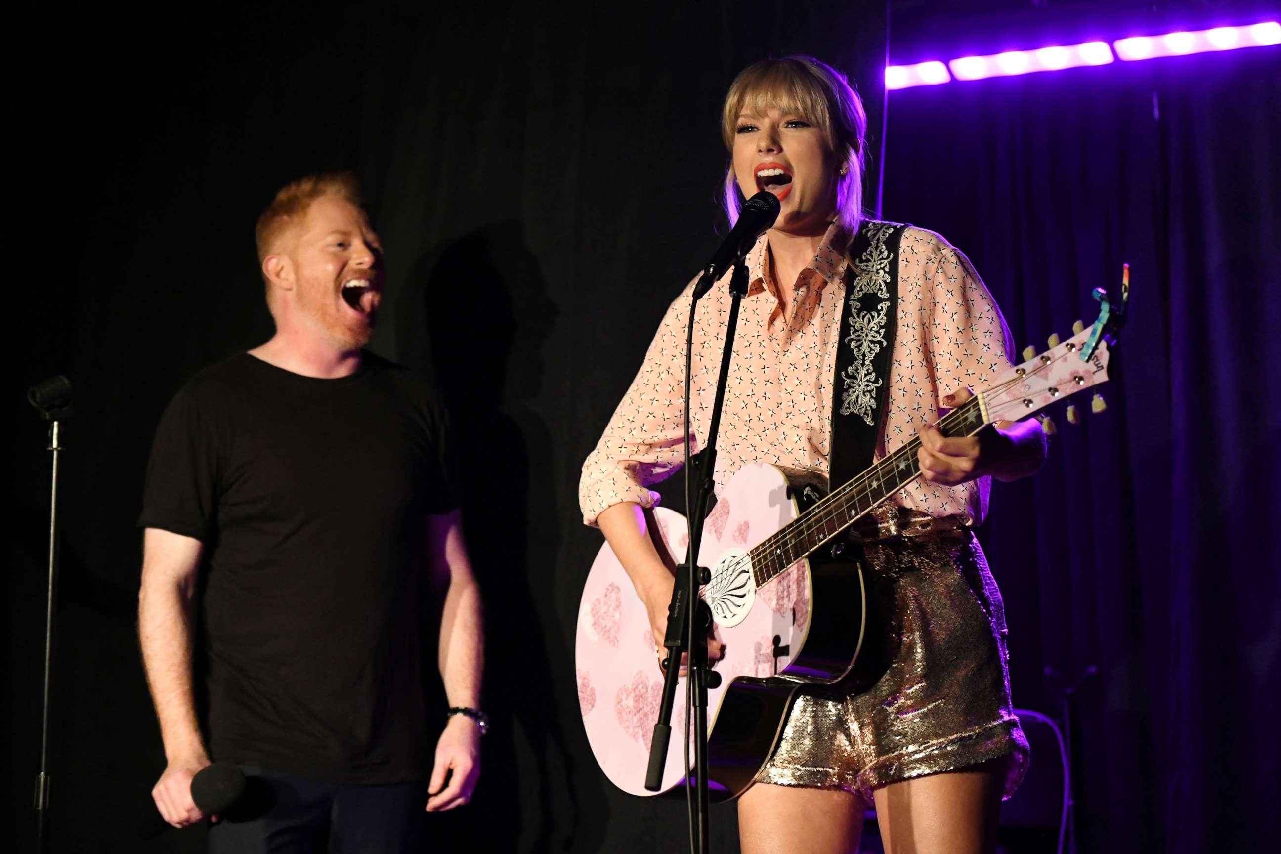 PHOTO: Jesse Tyler Ferguson (L) and Taylor Swift perform at AEG and Stonewall Inns pride celebration commemorating the 50th anniversary of the Stonewall Uprising.