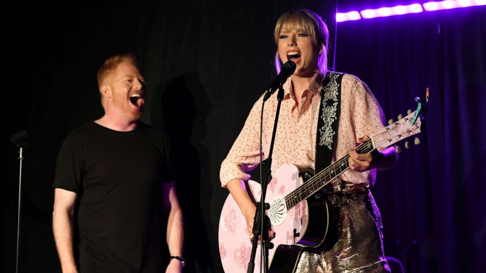 PHOTO: Jesse Tyler Ferguson (L) and Taylor Swift perform at AEG and Stonewall Inns pride celebration commemorating the 50th anniversary of the Stonewall Uprising.