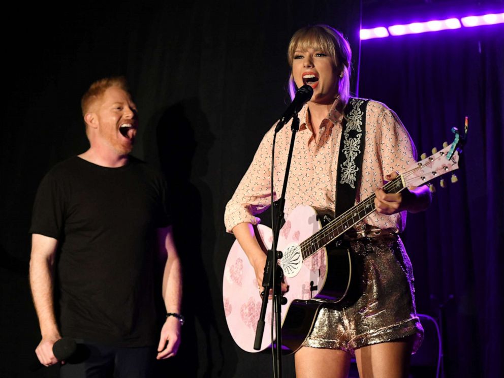 PHOTO: Jesse Tyler Ferguson (L) and Taylor Swift perform at AEG and Stonewall Inns pride celebration commemorating the 50th anniversary of the Stonewall Uprising.