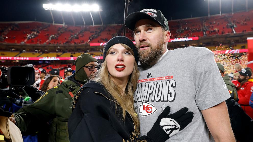 PHOTO: Taylor Swift celebrates with Travis Kelce #87 of the Kansas City Chiefs after defeating the Buffalo Bills 32-29 in the AFC Championship Game at GEHA Field at Arrowhead Stadium on Jan. 26, 2025, in Kansas City, Missouri. 