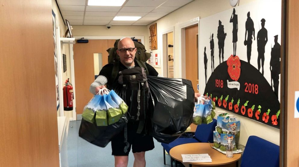 PHOTO: Zane Powles walks five miles daily to hand deliver lunch to 78 of his students.