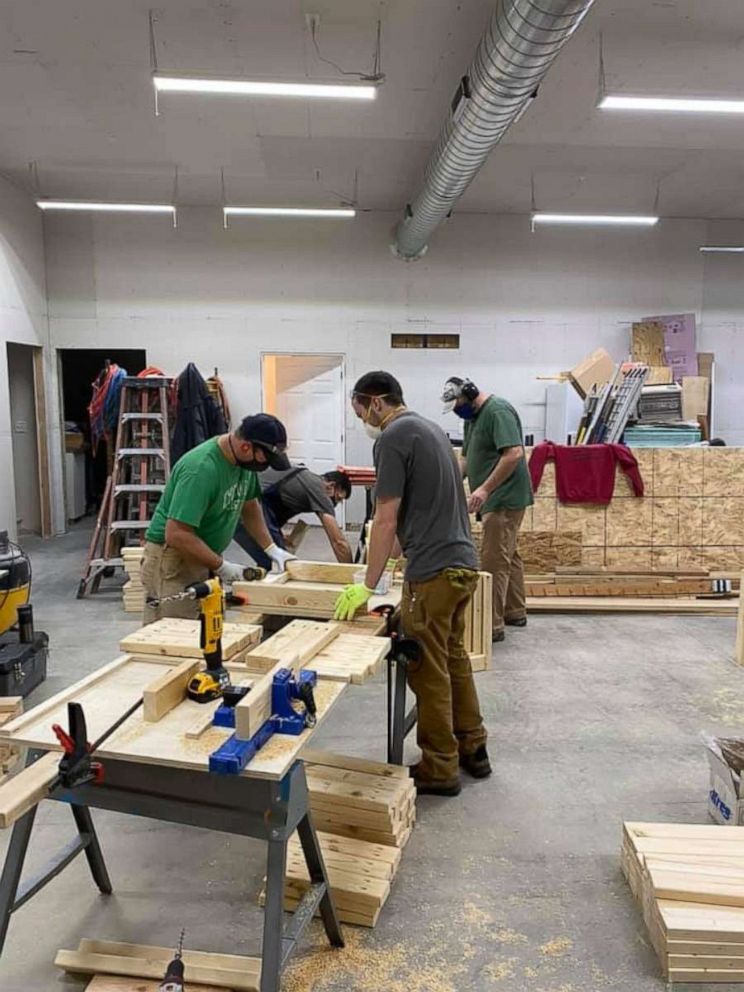 PHOTO: In the fall, Nate Evans, a 7th grade literacy teacher from Ankeny, launched the project he calls Woodworking with a Purpose. He and 50-plus volunteers have built roughly 600 desks for kids.