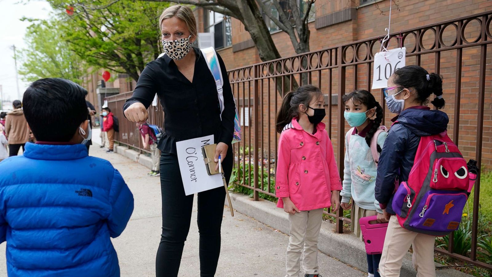 PHOTO: A school teacher greets members of her class in Jersey City, N.J., April 29, 2021.