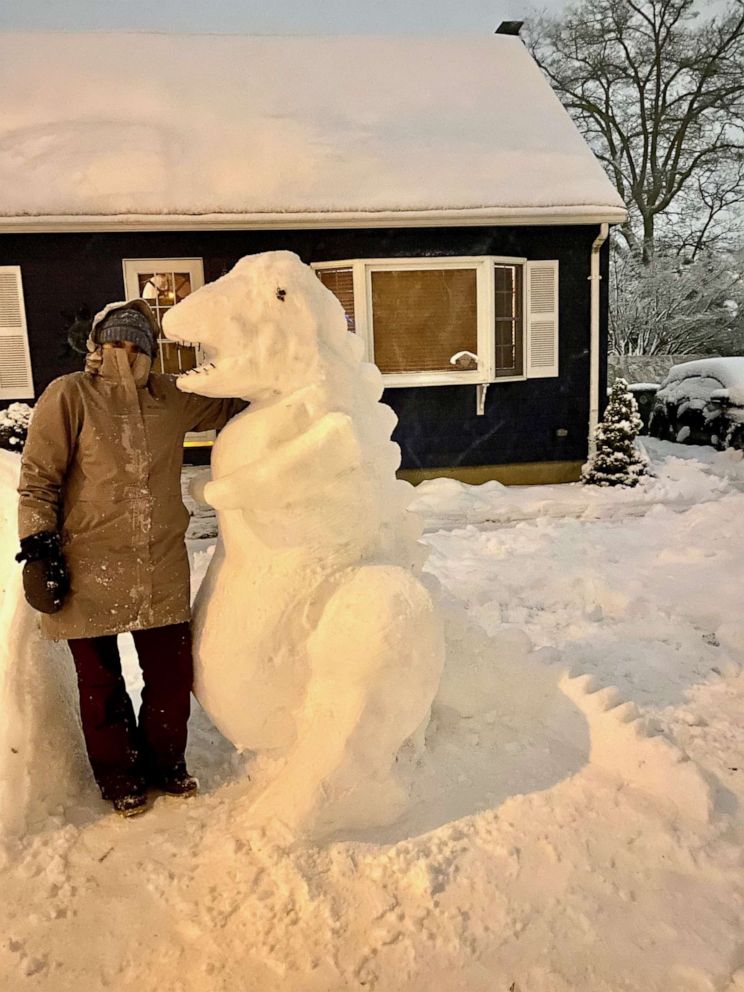 PHOTO: A middle school art teacher named Katina Gustafson of East Providence, Rhode Island, is inspiring her students to get creative during the pandemic by building epic snow sculptures in front of her home.