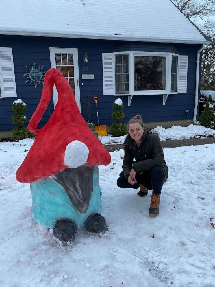 PHOTO: Katina Gustafson, an art teacher from East Providence, Rhode Island, made a gnome-inspired snow sculpture in front of her home to keep students entertained.