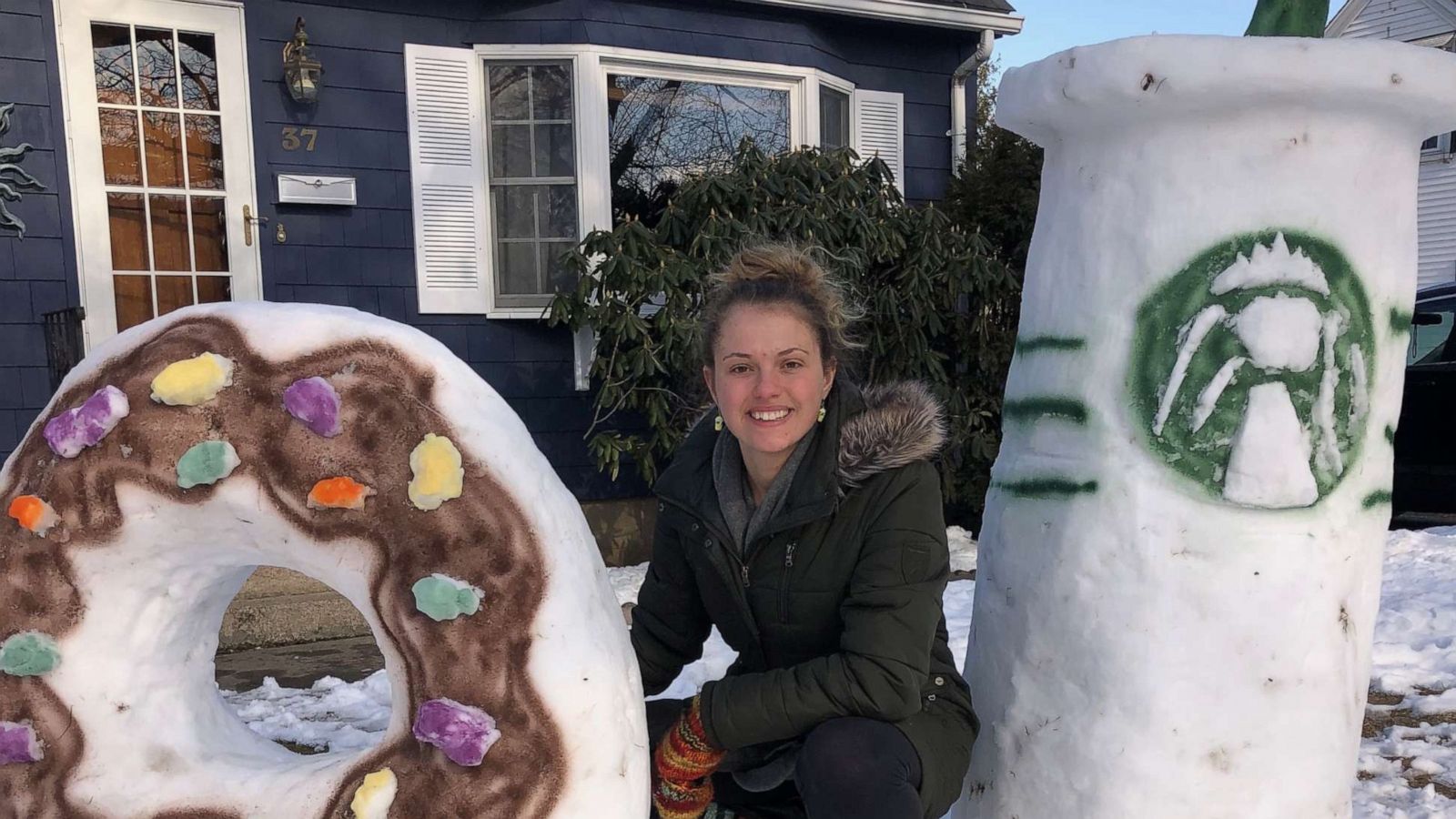 PHOTO: Katina Gustafson, an art teacher from East Providence, Rhode Island, made a Starbucks-inspired snow sculpture in front of her home to keep students entertained.