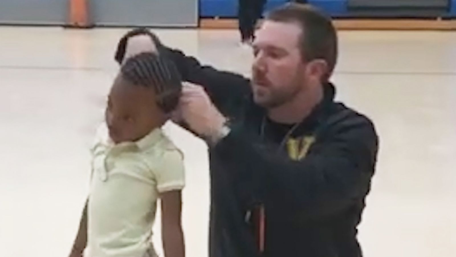 PHOTO: P.E. teacher Jonathan Oliver was filmed while putting Kristen Paulk's hair in a ponytail at WG Nunn Elementary School in Valdosta, Ga.