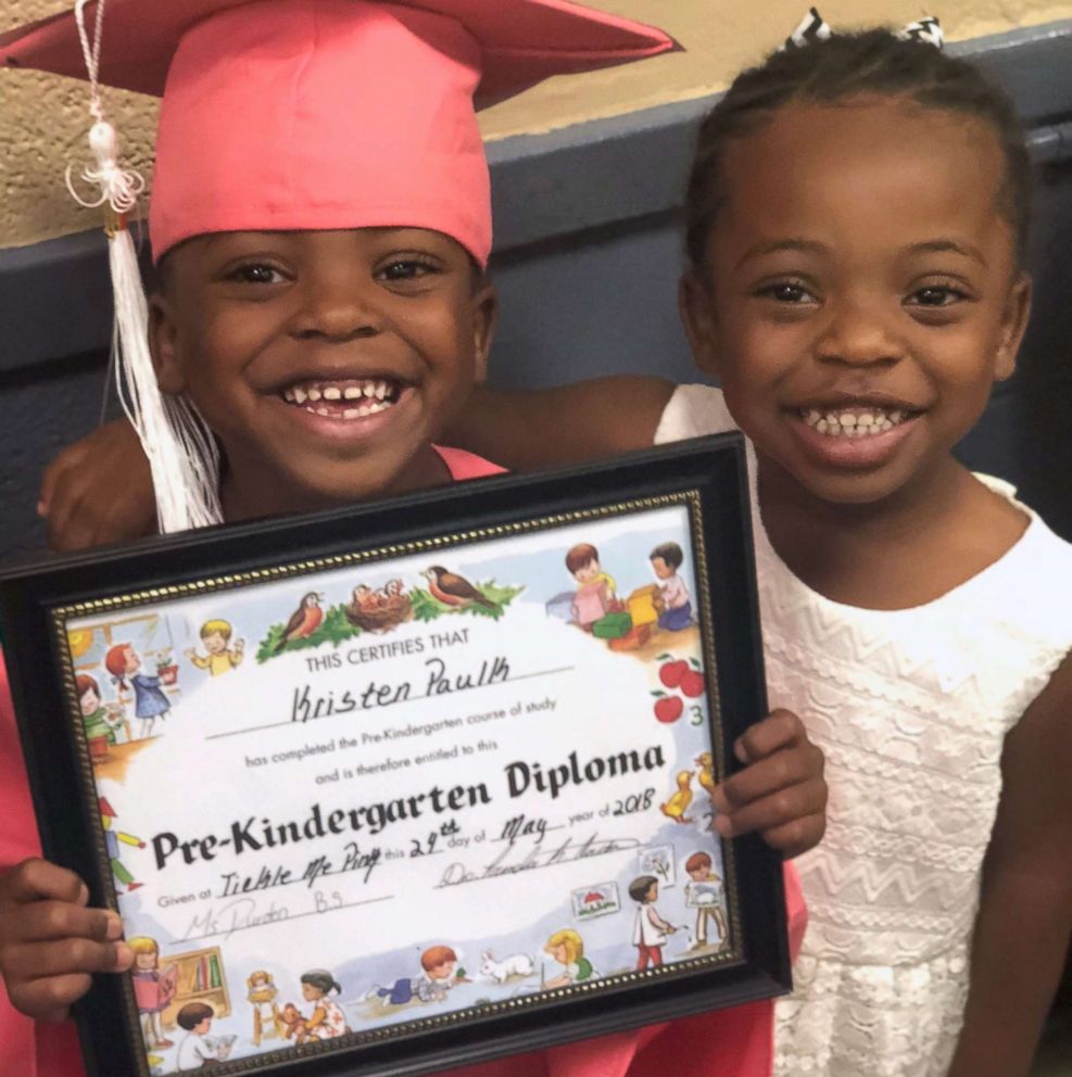 PHOTO: Kindergartner Kristen Paulk, left, is photographed with her sister, Claire Cleckly in an undated family photo. Kristen appeared in a viral video while her teacher Jonathan Oliver put her hair in a ponytail during gym class.