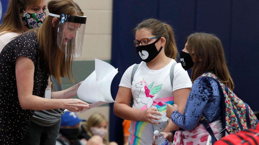 VIDEO: School staff, students bear risk of school reopenings amid ongoing pandemic