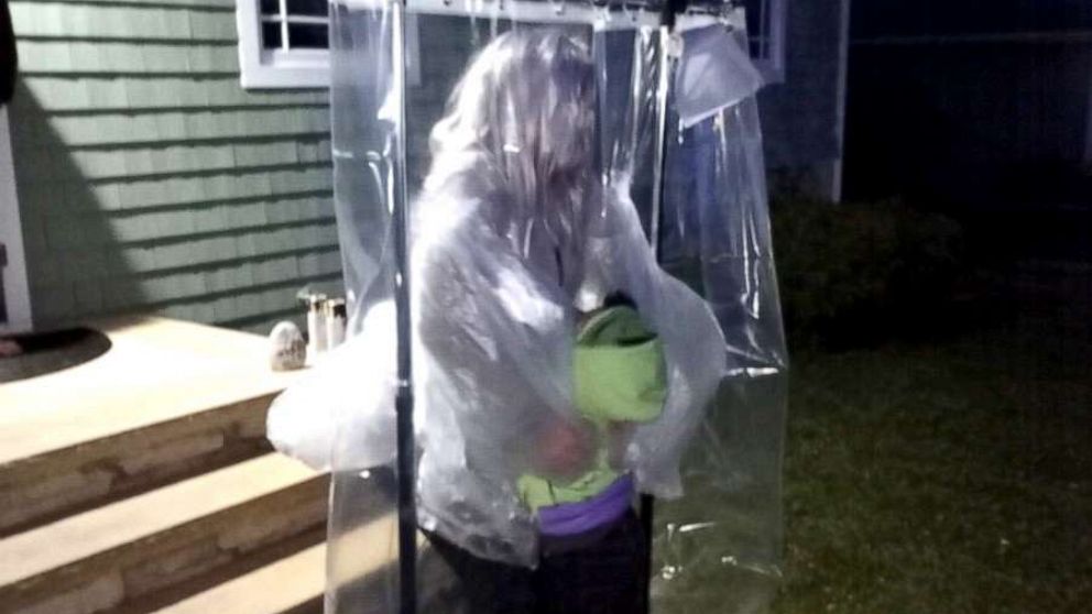 PHOTO: On March 13, Avery Green, 5, and his parents, Cathie and Al Green of Riverhead, New York, delivered the "hugging machine," to kindergarten teacher Keri Stromski outside of her Aquebogue, New York, home.