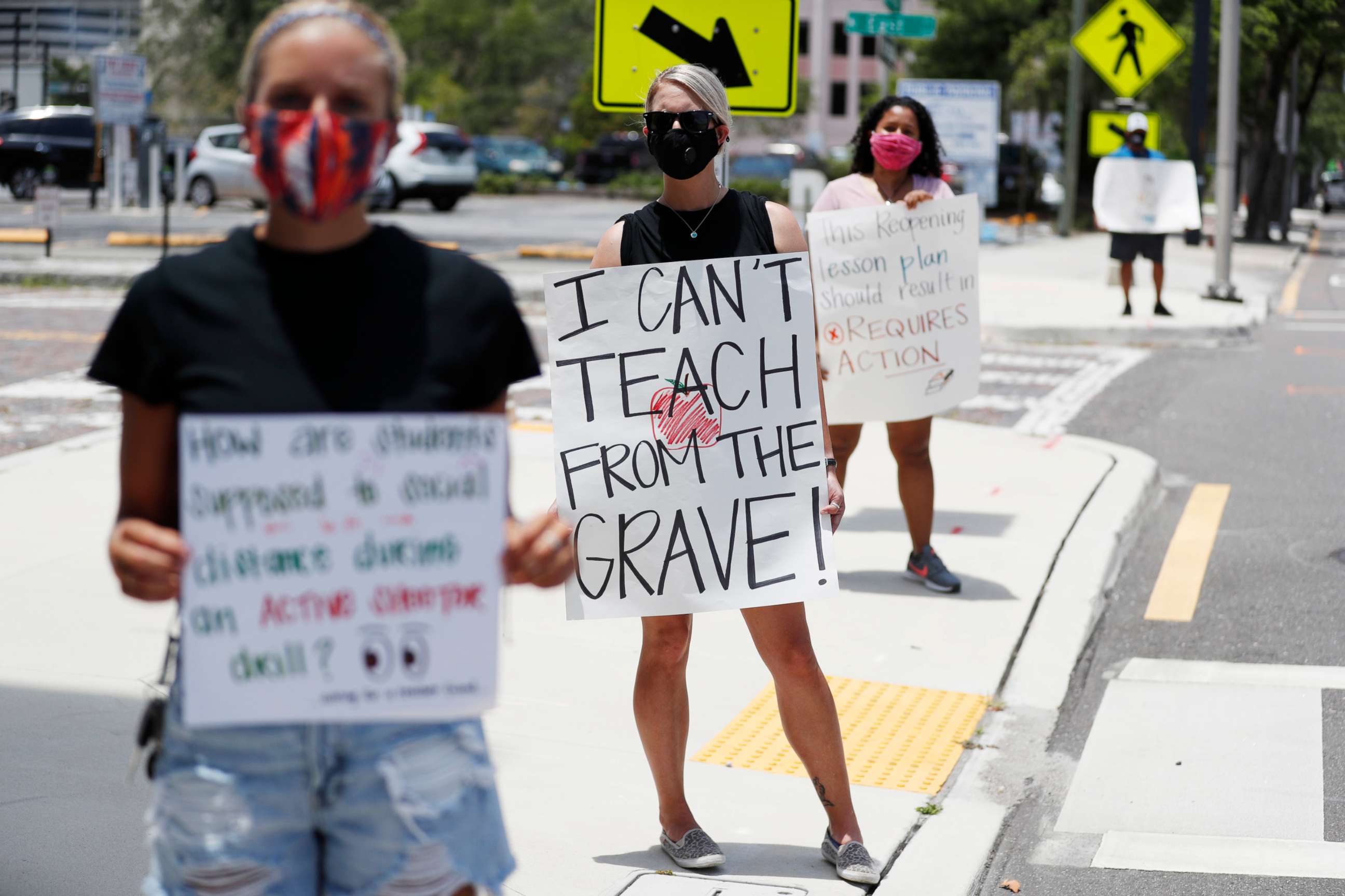 PHOTO: Teachers stand in protest in front of the Hillsborough County Schools District Office on July 16, 2020 in Tampa, Florida.