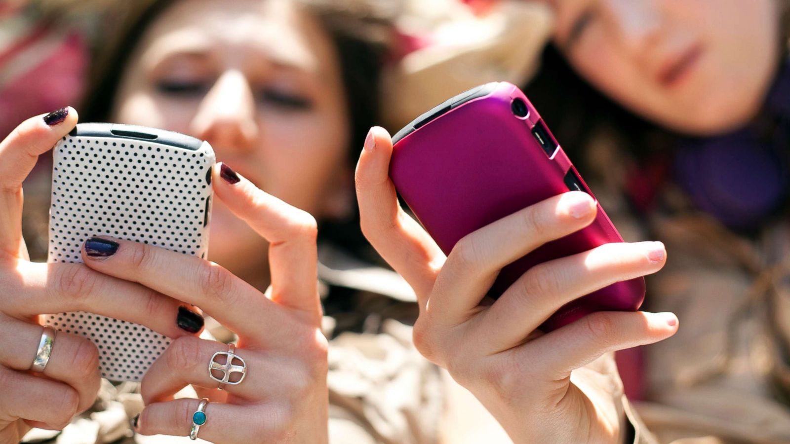 PHOTO: This stock image depicts two teen girls on their cellphone.