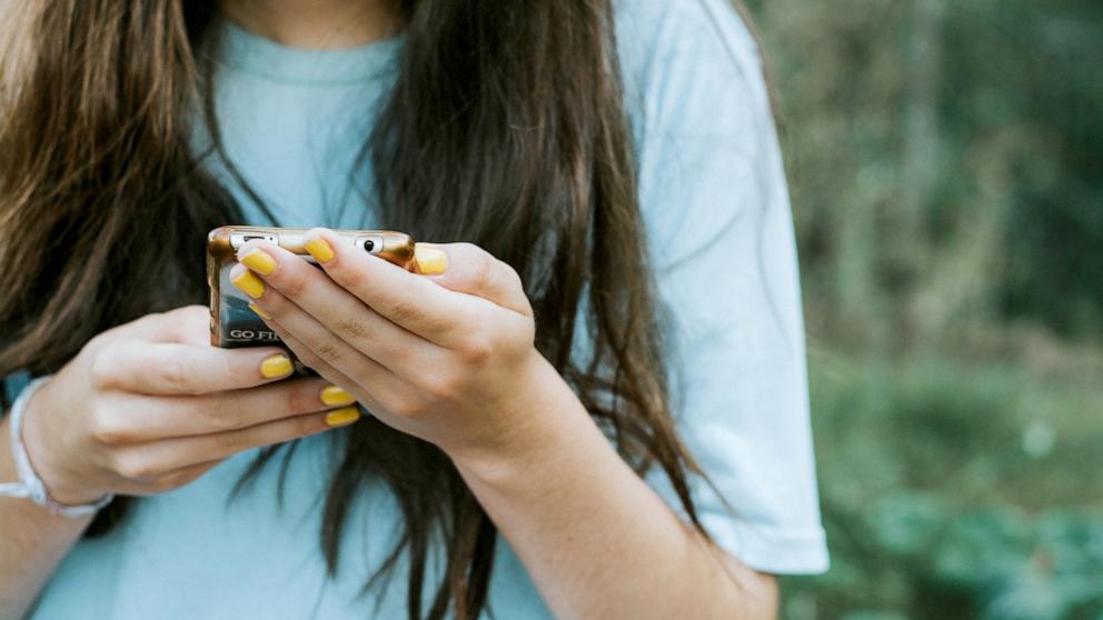 PHOTO: Stock photo of a teen girl on her cellphone.