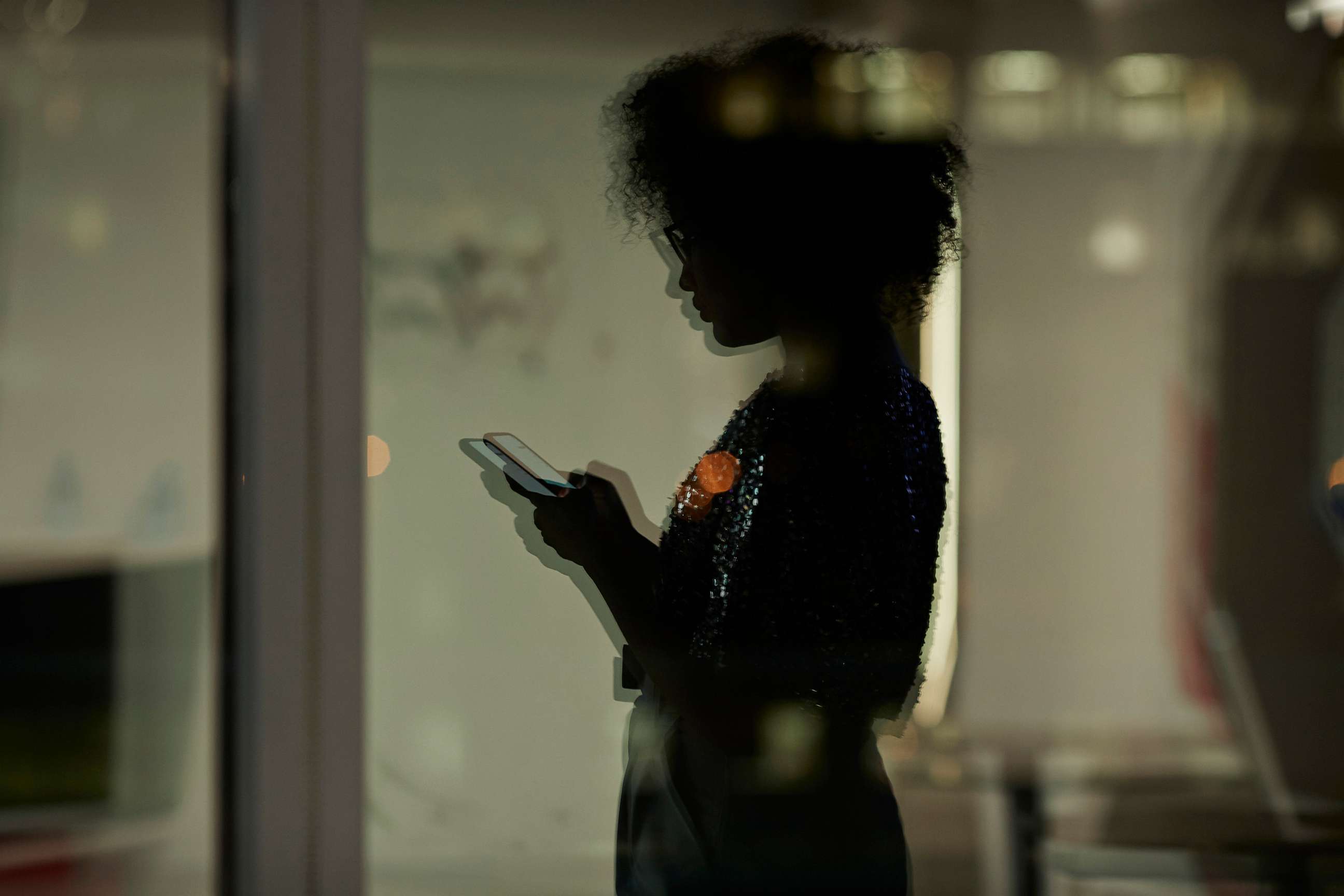 PHOTO: An undated stock photo shows the silhoutte of a person looking at their phone.