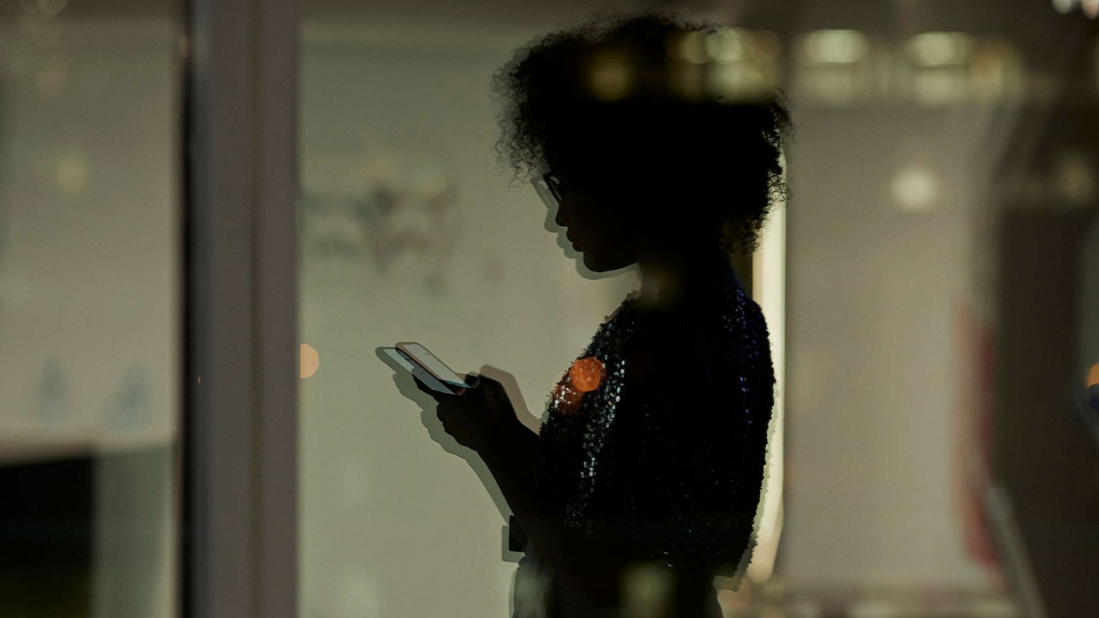 PHOTO: An undated stock photo shows the silhoutte of a person looking at their phone.