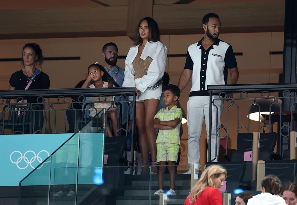 PHOTO: Chrissy Teigen and John Legend look on with their children as they attend the Artistic Gymnastics Women's Qualification on day two of the Olympic Games Paris 2024 at Bercy Arena on July 28, 2024 in Paris, France.