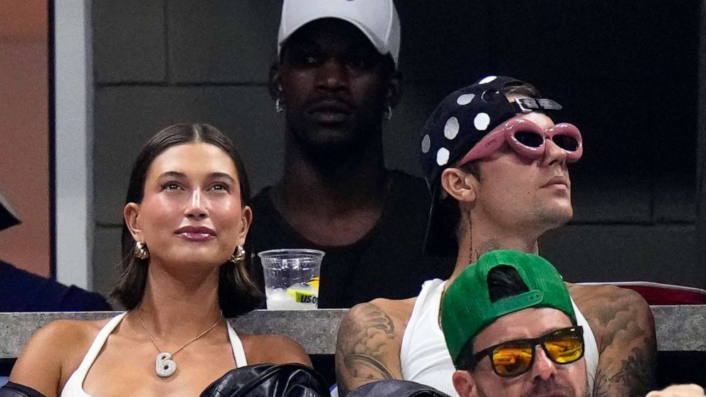 PHOTO: Miami Heat's Jimmy Butler, Justin Bieber, alongside his wife Hailey Bieber, watch the third round of the U.S. Open tennis championships, Sept. 1, 2023, in New York.