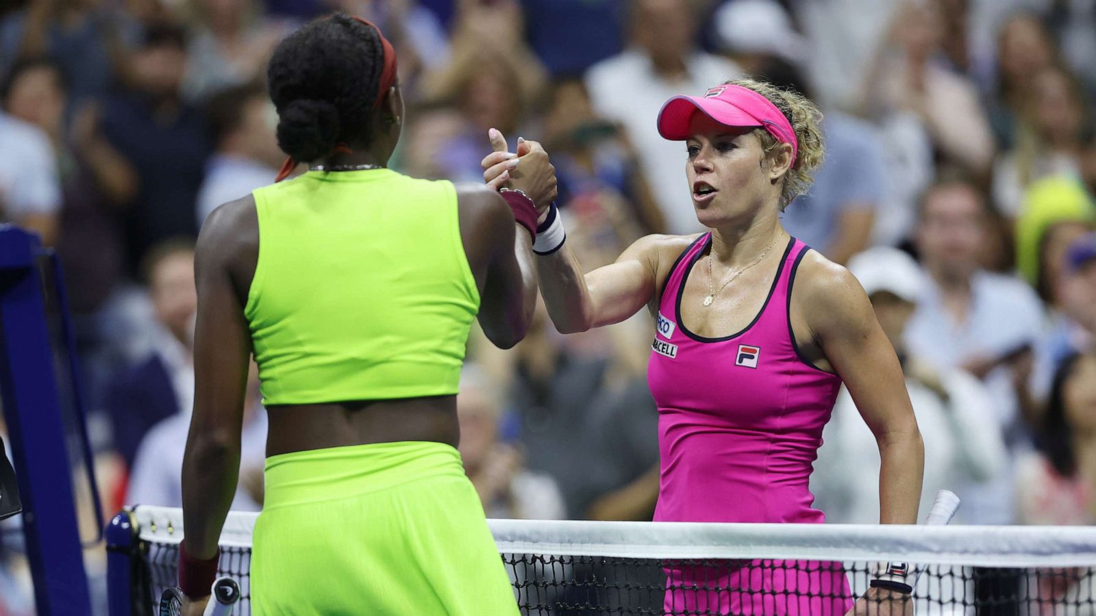 PHOTO: Laura Siegemund (R) shakes hands with Coco Gauff following their Women's Singles First Round match at the USTA Billie Jean King National Tennis Center on Aug. 28, 2023 in the Flushing neighborhood of the Queens borough of New York City.