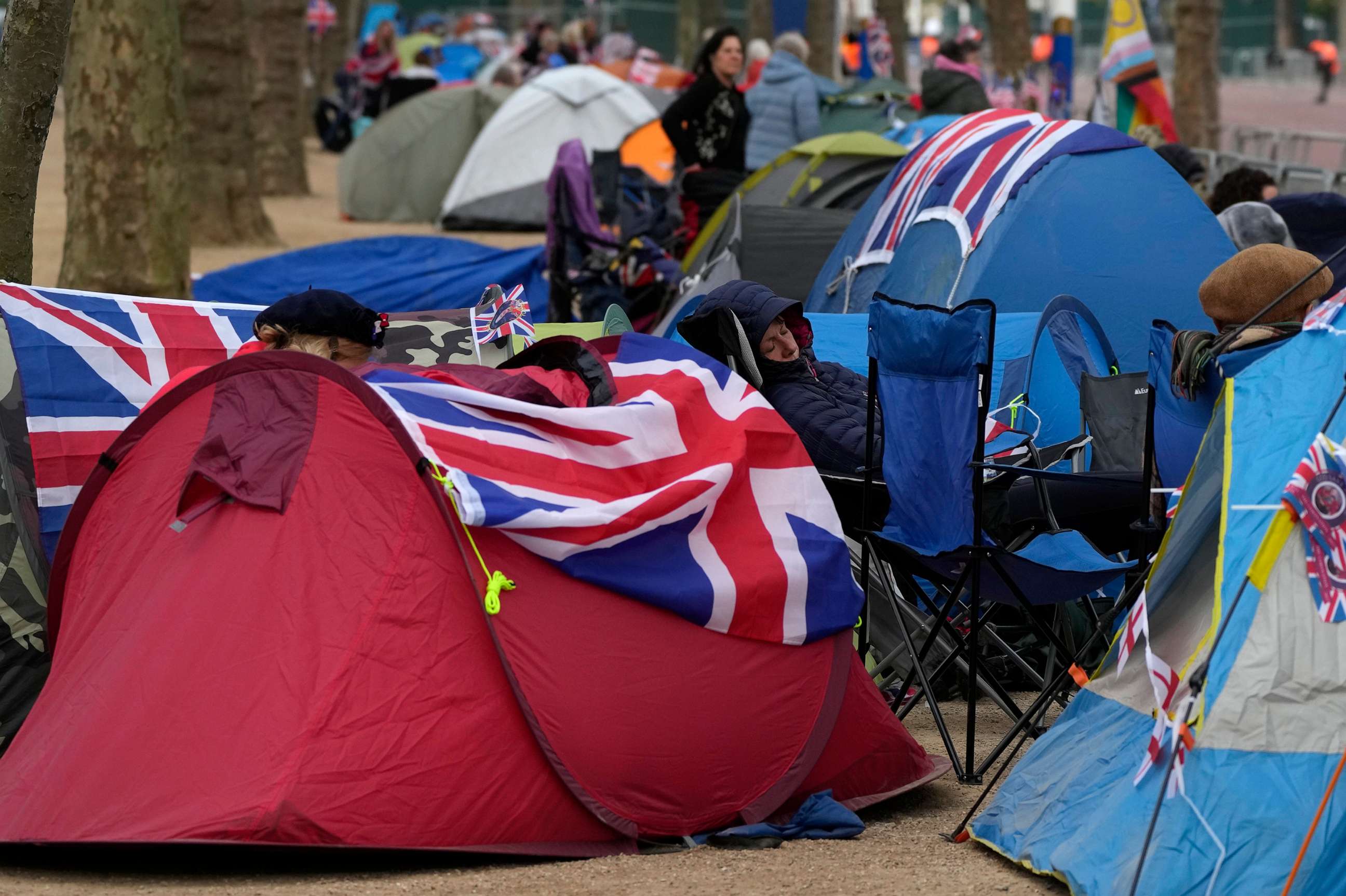 PHOTO: Royal fans who have spent the night camping out along The Mall, part of the Coronation route, begin to wake up, May 5, 2023.