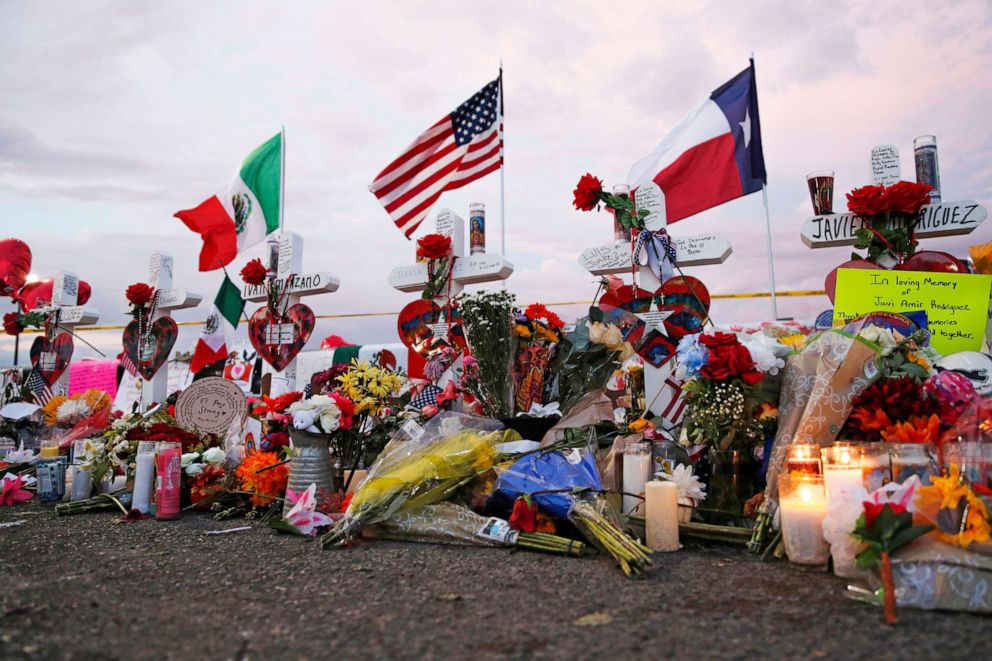 PHOTO: Flags fly over crosses at a makeshift memorial near the scene of a mass shooting at a shopping complex Tuesday, Aug. 6, 2019, in El Paso, Texas.