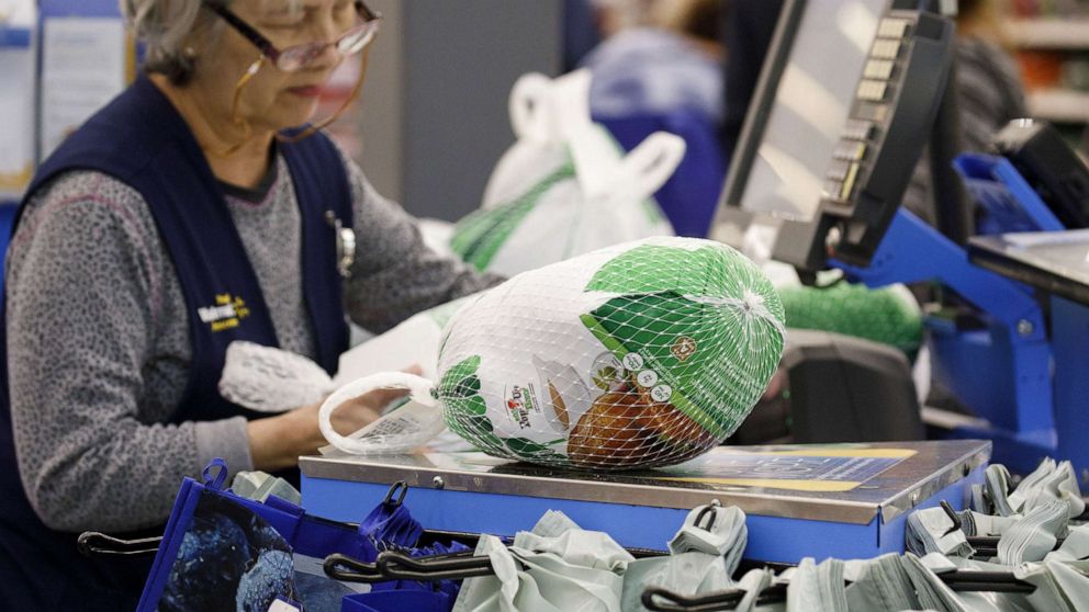 PHOTO: Frozen turkeys are scanned at check by a cashier at a Walmart store in Burbank, Calif., Nov. 26, 2019.