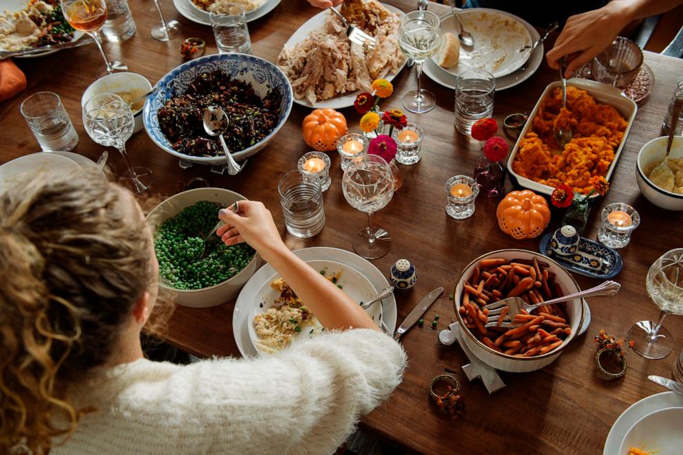 PHOTO: In an undated stock photo, a family is seen eating Thanksgiving dinner around a table. 