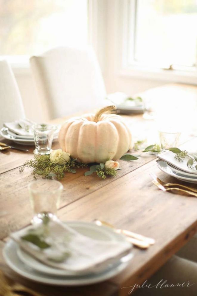 PHOTO: Use a large white pumpkin and fresh greenery or flowers to make a simple centerpiece for Thanksgiving. 