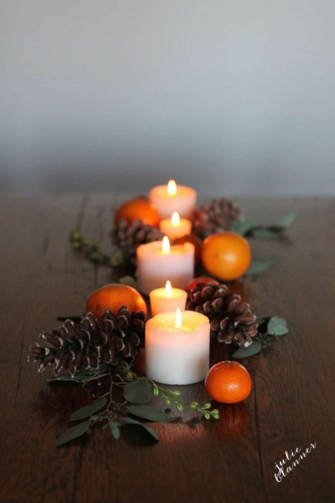 PHOTO: Try this festive table setting using fresh fruit and pine cones for a simple fall feel.