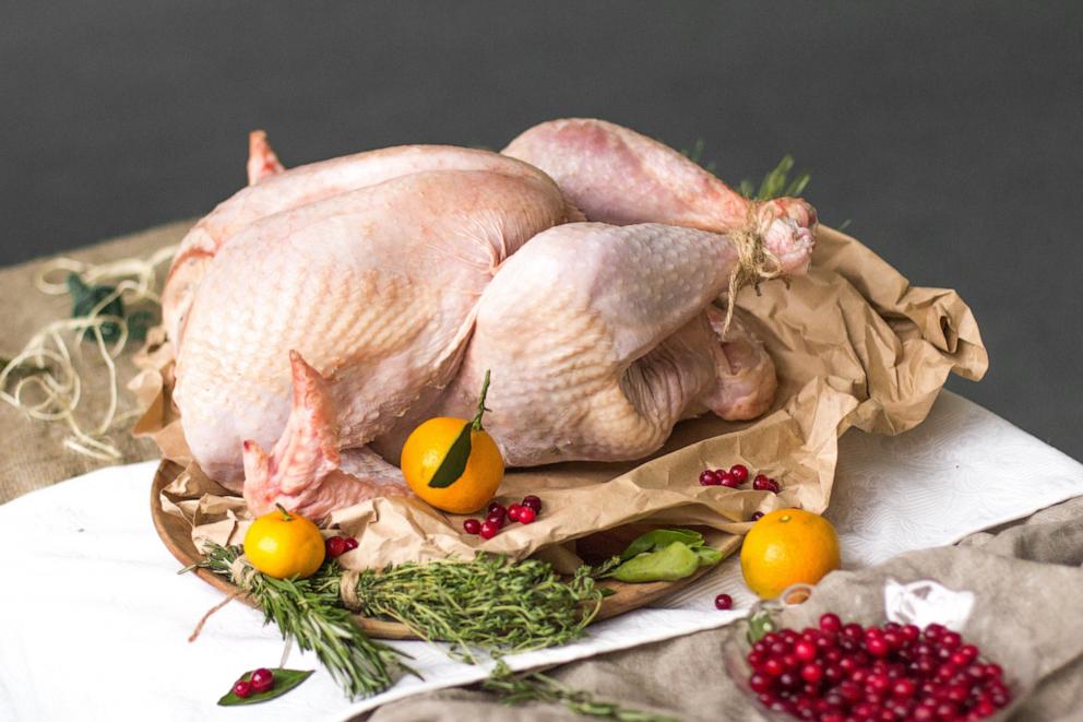 PHOTO: Fresh raw turkey in a roasting pan ready for the oven.