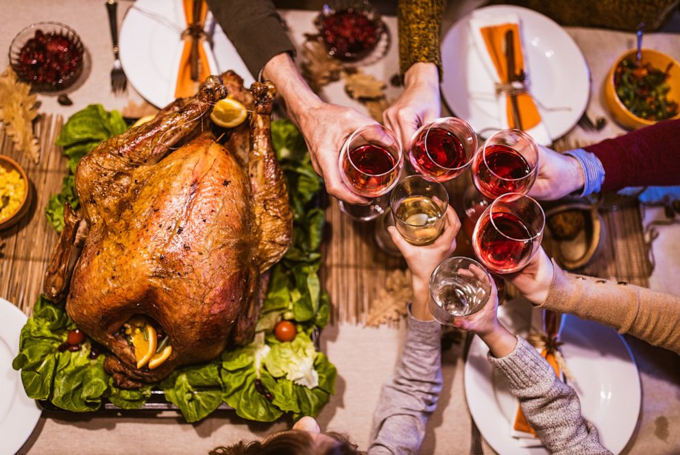 PHOTO: A group toasts with wine over a Thanksgiving table in an undated stock photo.