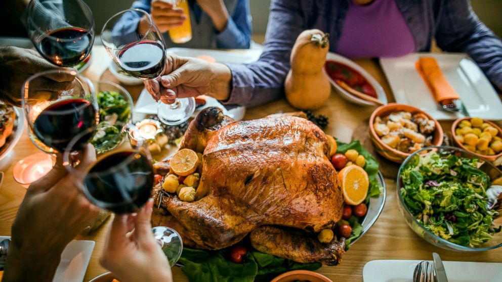 PHOTO: This stock photo depicts a family toasting with a glass of wine before enjoying a Thanksgiving meal.
