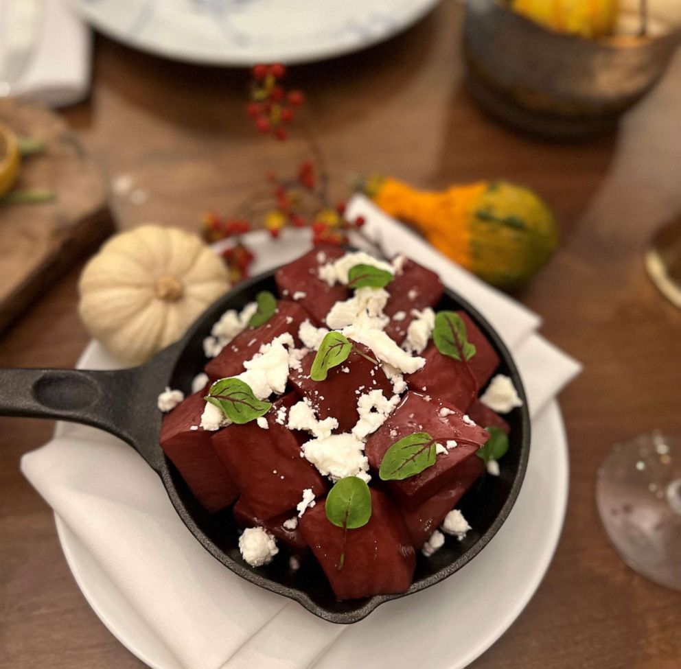 PHOTO: A skillet of roasted beets with red wine reduction and goat cheese.