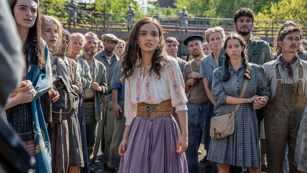 PHOTO: Honor Gillies as Barb Azure, Konstantin Taffet as Clerk Carmine and Rachel Zegler as Lucy Gray Baird in "The Hunger Games: The Ballad of Songbirds and Snakes."