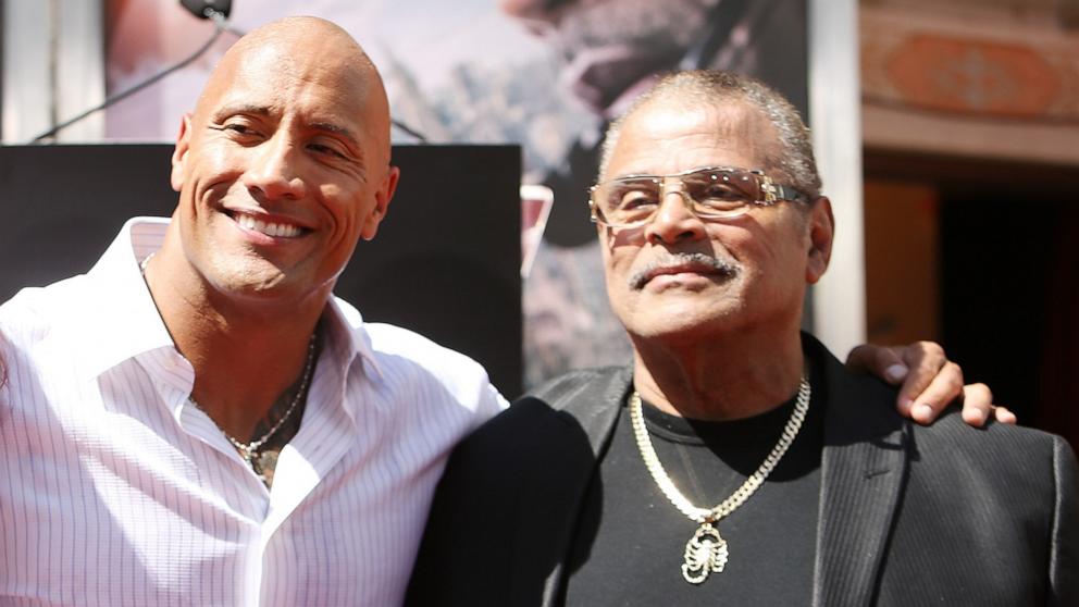 PHOTO: Dwayne "The Rock" Johnson and dad at the hand/footprint ceremony honoring him held at TCL Chinese Theatre IMAX on May 19, 2015 in Hollywood, Calif.