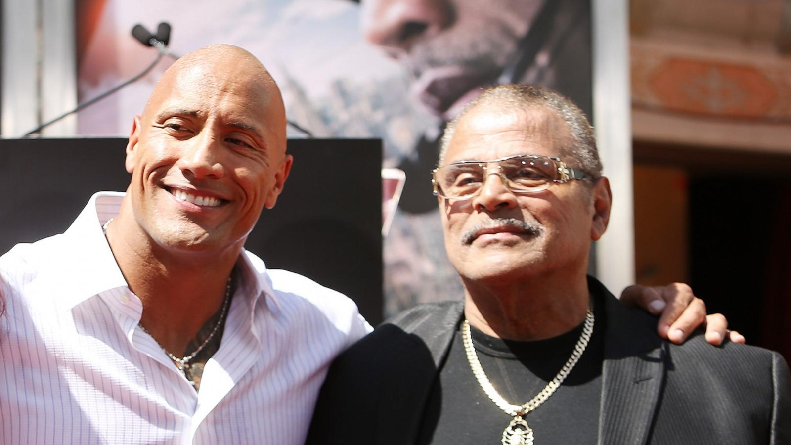 PHOTO: Dwayne "The Rock" Johnson and dad at the hand/footprint ceremony honoring him held at TCL Chinese Theatre IMAX on May 19, 2015 in Hollywood, Calif.