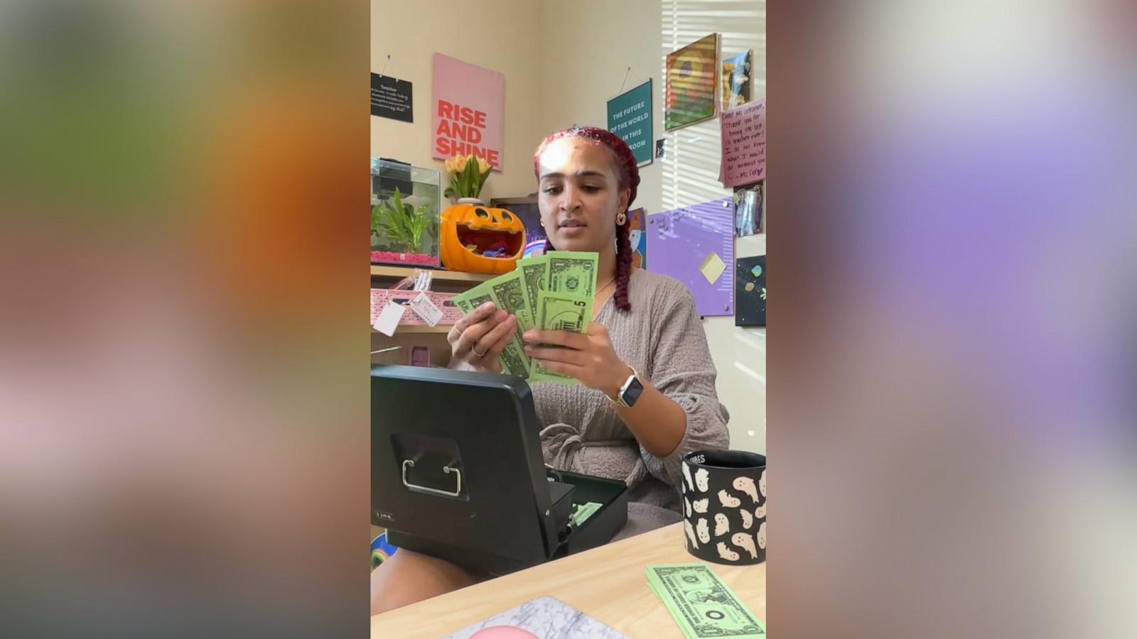 PHOTO: Teacher Shelby Lattimore collects “rent” from her third-grade students at the start of each month of the school year, part of an initiative to teach students financial literacy and encourage attendance.