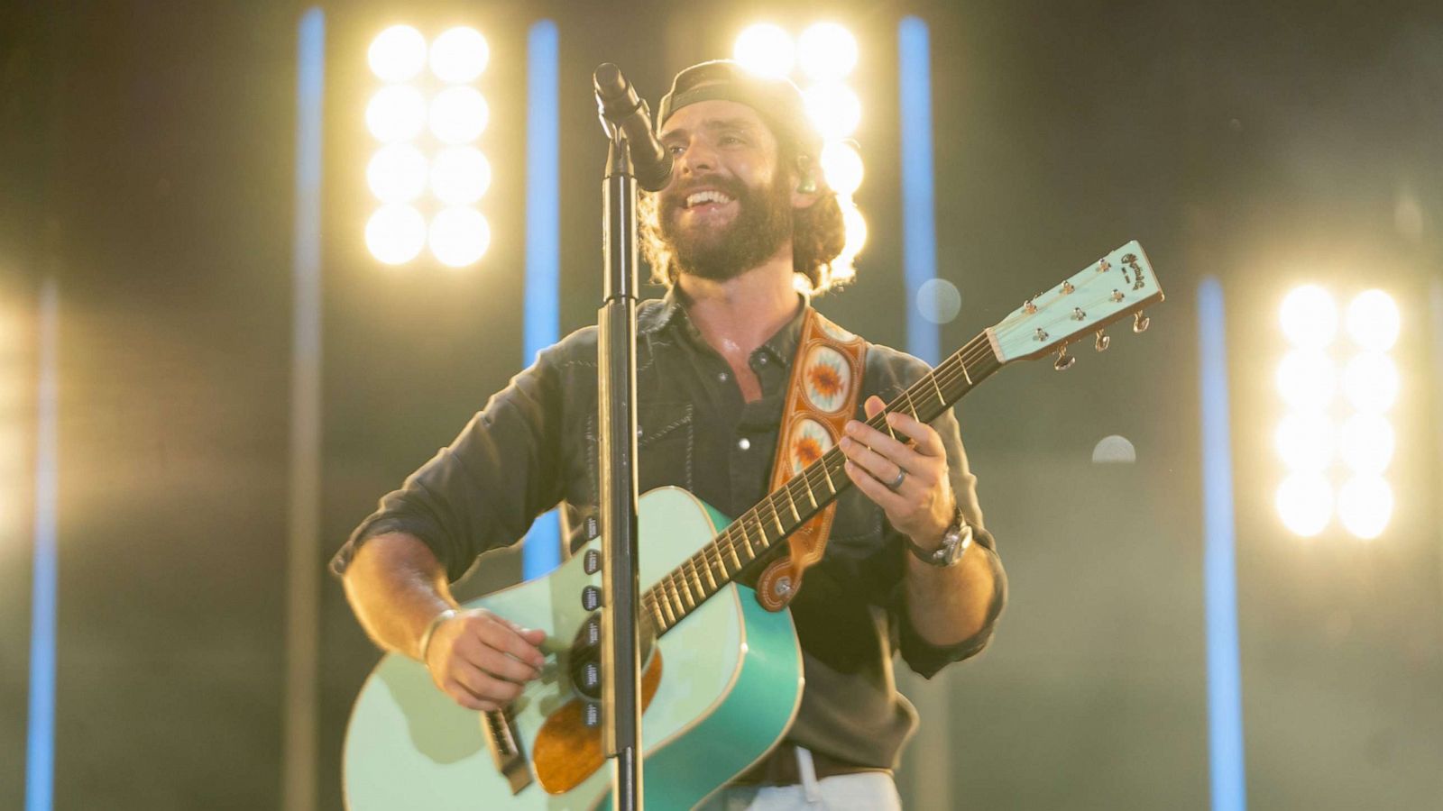 PHOTO: In this July 28, 2021, file photo, Thomas Rhett plays on stage in Nashville, Tenn.