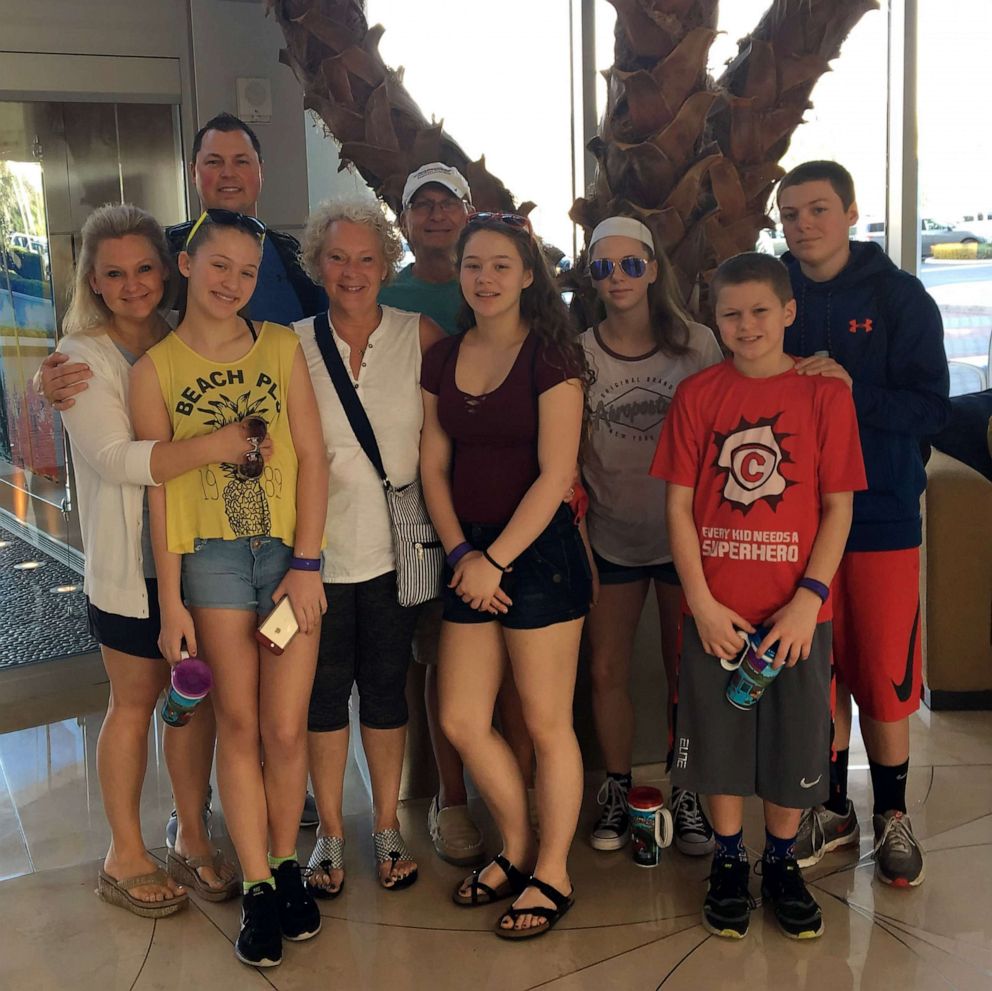 PHOTO: Amy Malczewski and Lewis Malczewski are parents of five. The family is pictured with grandparents Christy and Paul Schwan.