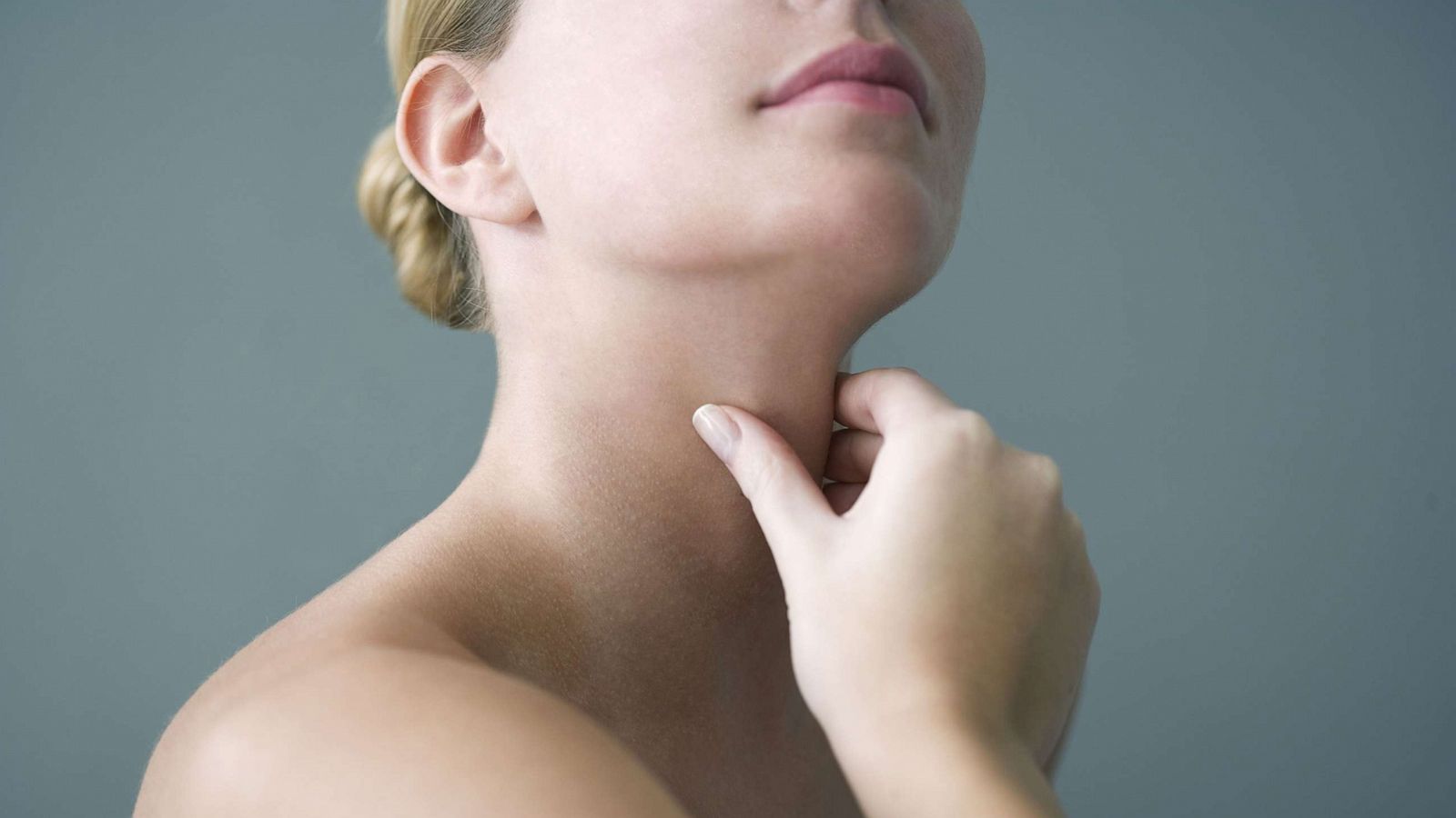 PHOTO: A person appears to hold their thyroid in this stock photo.