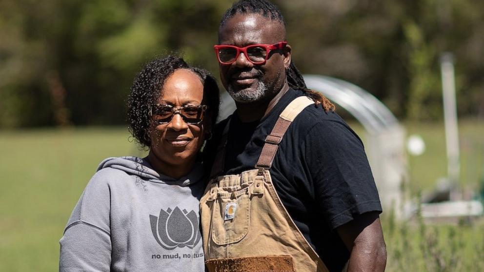 PHOTO: Chefs and farmers, co-founders of Strong Roots 9, Tia and Matthew Raiford on Gilliard Farms in Brunswick, Georgia.