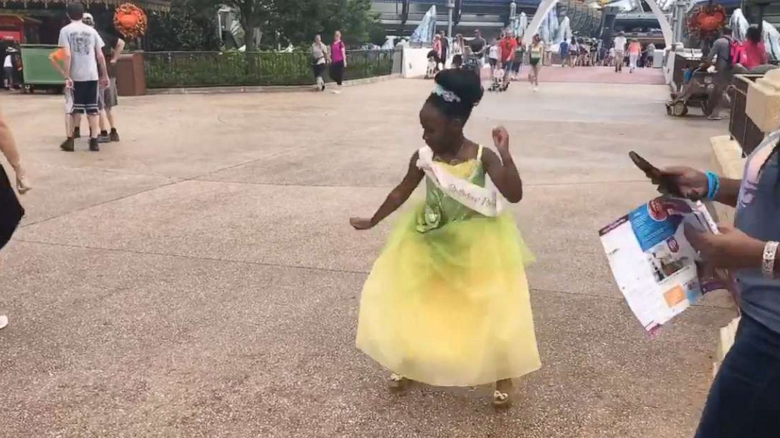 PHOTO: 8-year-old Sydney Elise Russell dances at Walt Disney World dressed as Princess Tiana.