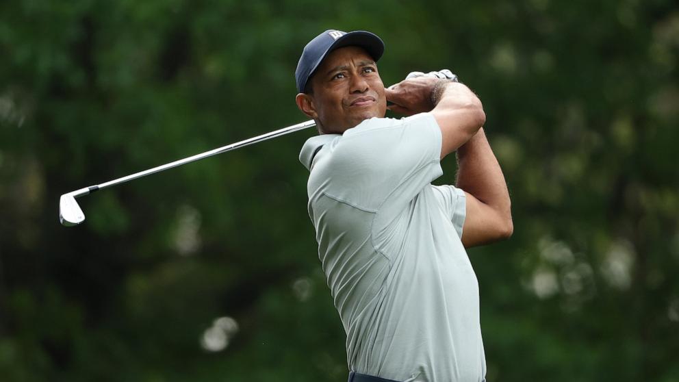 PHOTO: Tiger Woods of the United States plays his shot from the fourth tee during a practice round prior to the 2023 Masters Tournament at Augusta National Golf Club, April 4, 2023, in Augusta, Ga.