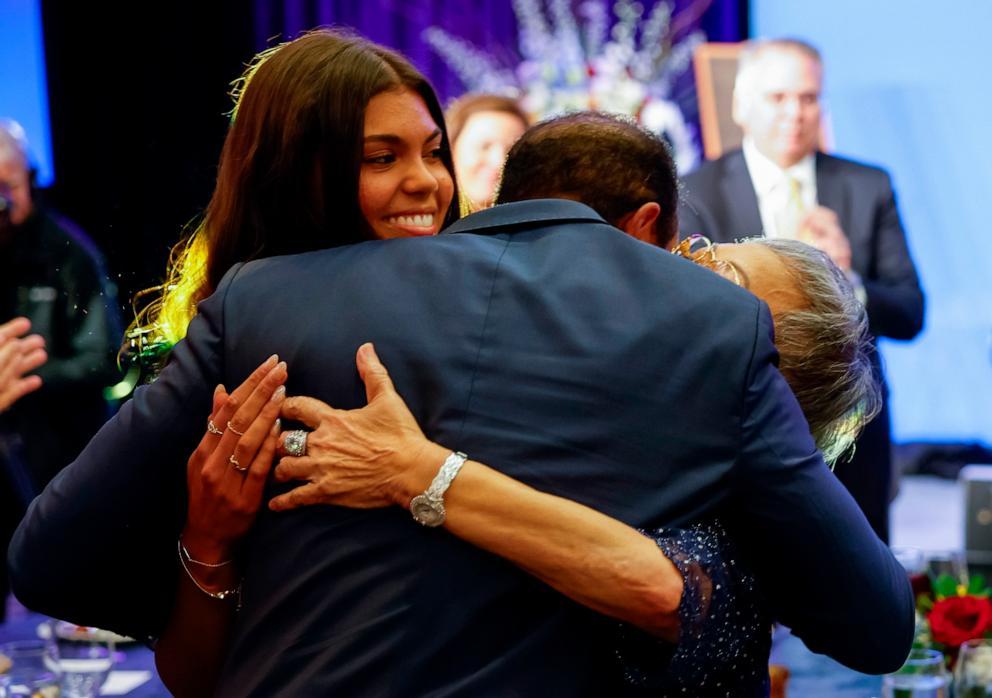 PHOTO: Tiger Woods hugs his mother Kultida Woods and daughter Sam Alexis Woods after receiving the Bob Jones Award ahead of the 2024 U.S. Open, in Pinehurst, N.C., June 11, 2024.