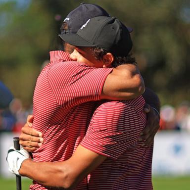 PHOTO: Tiger Woods of the United States reacts with his son Charlie Woods after holing out on the fourth hole during the second round of the PNC Championship at Ritz-Carlton Golf Club on Dec. 22, 2024 in Orlando, Fla.