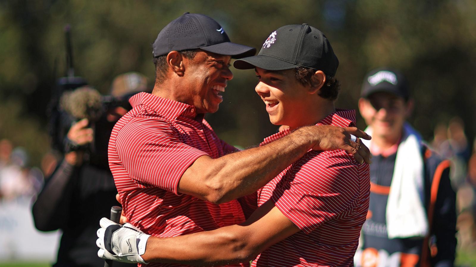 PHOTO: Tiger Woods of the United States reacts with his son Charlie Woods after holing out on the fourth hole during the second round of the PNC Championship at Ritz-Carlton Golf Club on Dec. 22, 2024 in Orlando, Fla.