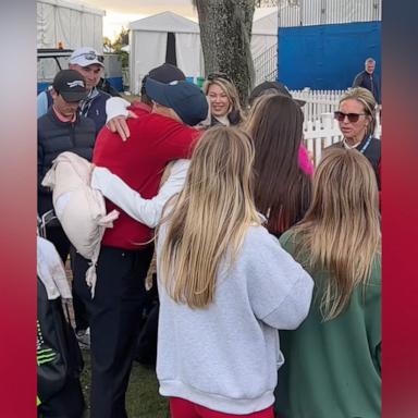 PHOTO: Tiger Woods and ex-wife Elin Nordegren are seen sharing a hug at the PNC Championship on Sunday, Dec. 22.