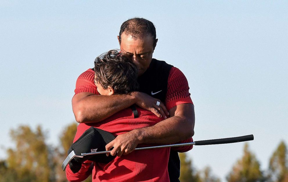 PHOTO: Tiger Woods embraces his son Charlie Woods, Dec. 18, 2022, on the 18th hole during the final round of the PNC Championship at the Ritz-Carlton Golf Club in Orlando, Fla,.