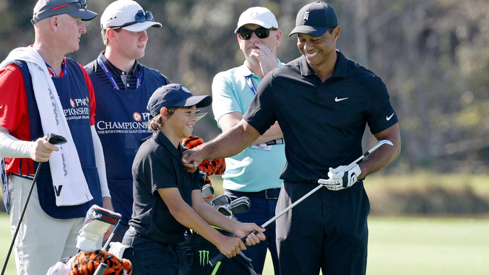 Tiger Woods returns to competitive golf alongside 12-year-old son Charlie
