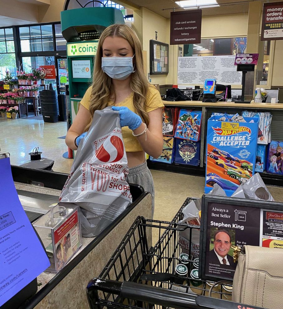 PHOTO: High-school junior Natalie Reese picks up supplies from the store for sanitation kits that she and her family give out to UPS and mail workers in Danville, Calif.