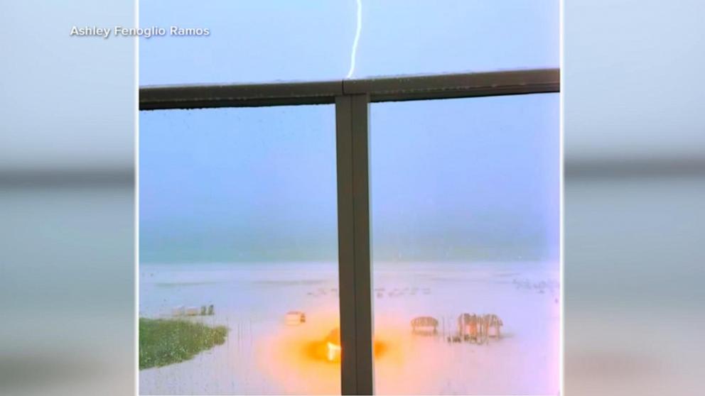 PHOTO: A bolt of lightning struck a tiki hut on a beach in Florida where a group of women took cover from the storm.
